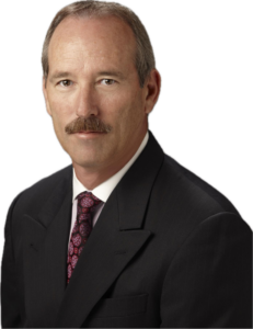 image (2) A man with a mustache wearing a suit and tie.